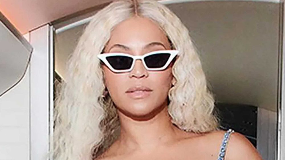 Beyonce stuns in sequined bra and double denim as she flies on private jet